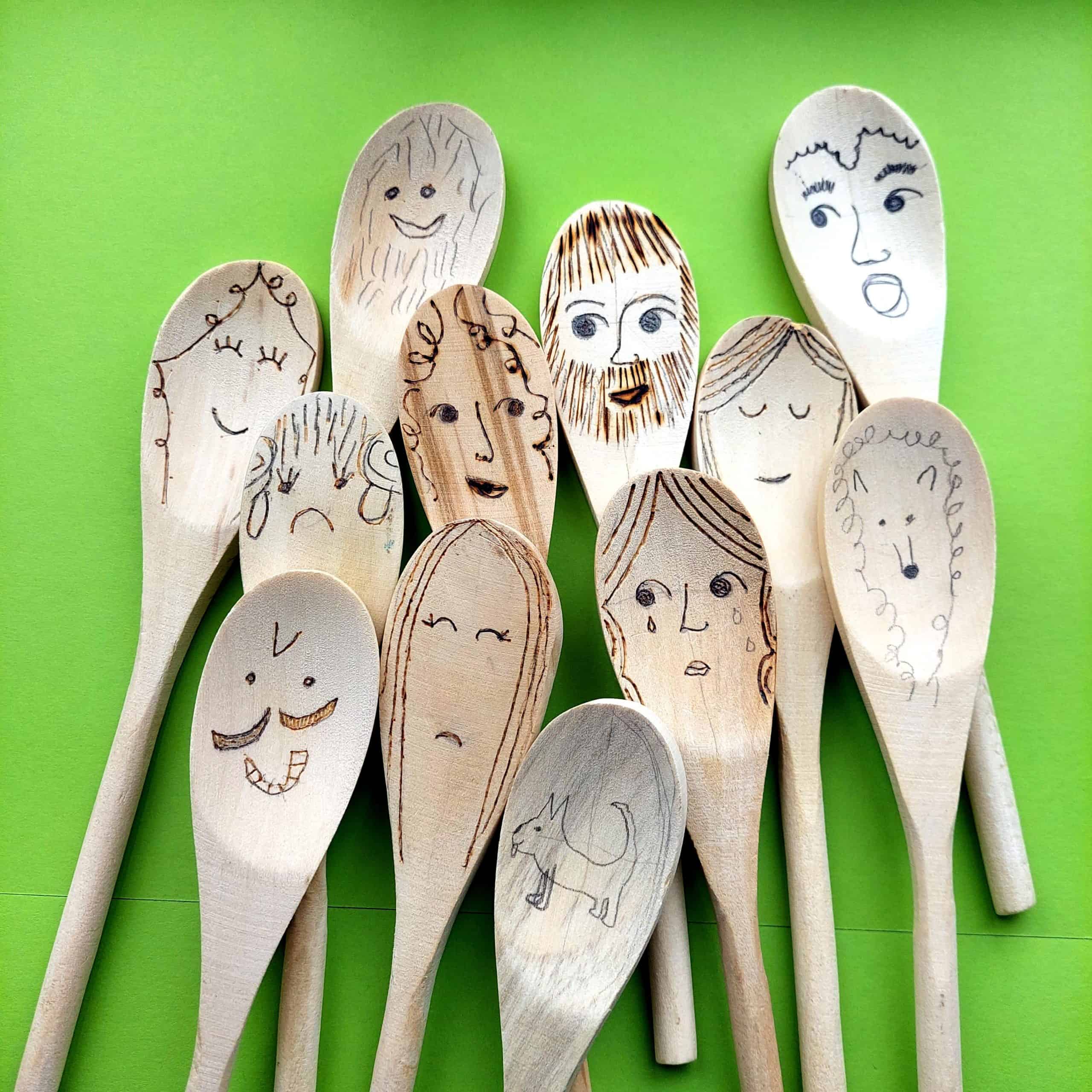 wooden spoons with faces drawn on them for a story